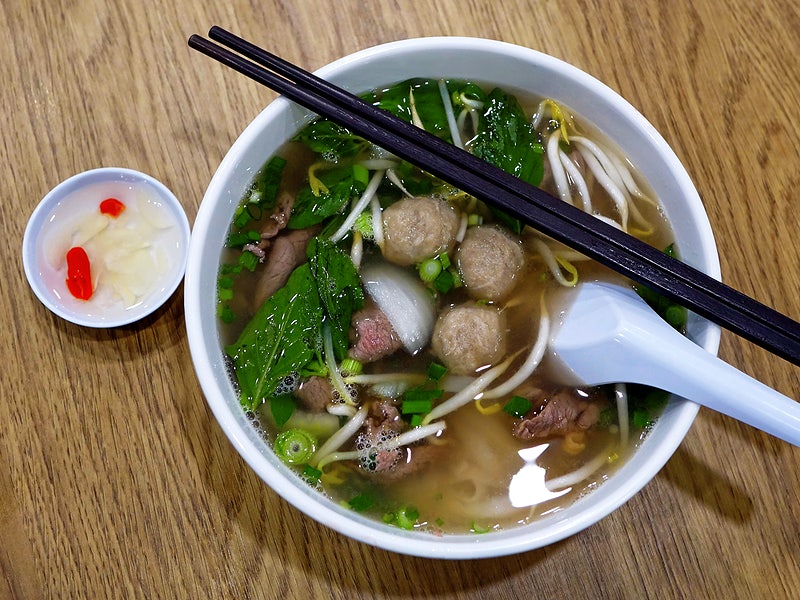A bowl of pho with lots of herbs and spices treat many diseases